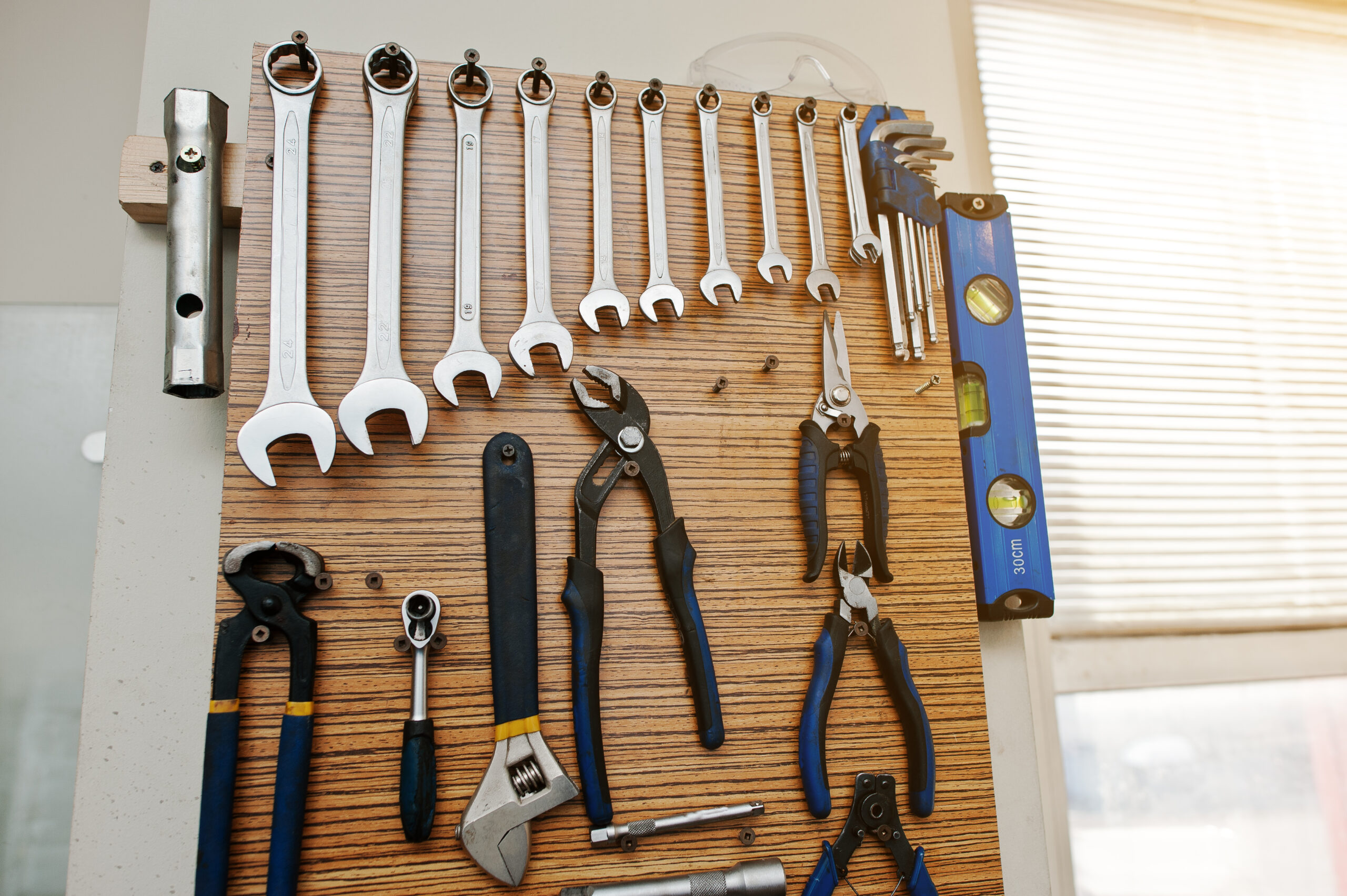 Group of used tools on wood deck, toolkit
